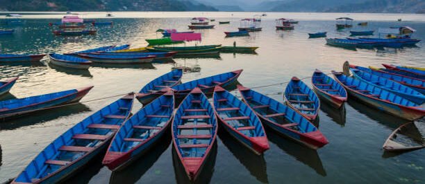 Empty boats in Fewa Lake in the evening